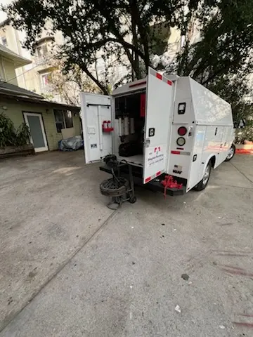 Magnet Plumbing service vehicle on-site for Grease Trap Cleaning in Delmar Estates